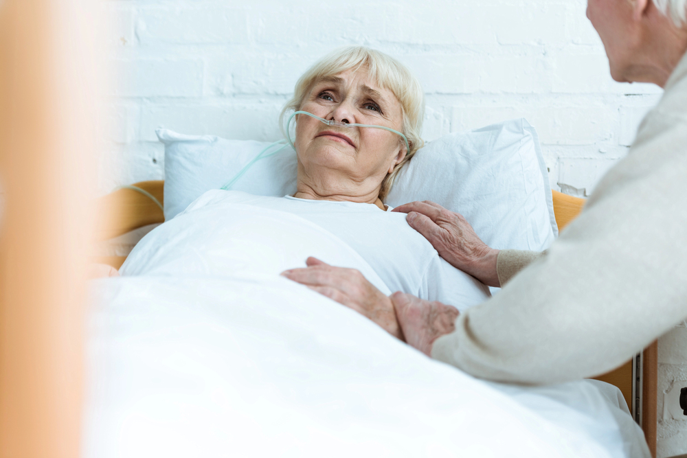 Nursing home staff documenting the progression of a pressure ulcer